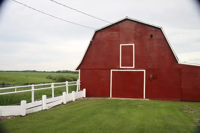Red barn beside a pasture