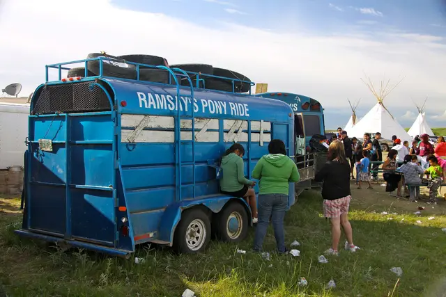 Ramsay's Pony Ride trailer at a powwow gathering